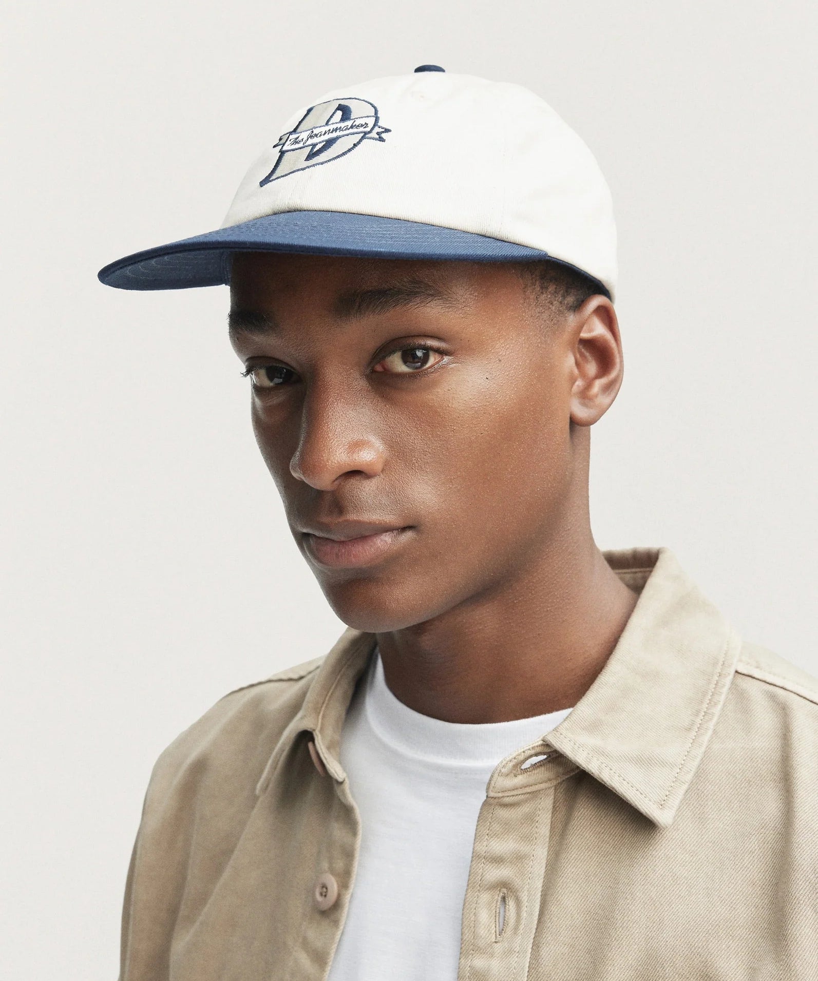 AURO-VARSITY6-PANEL-CAP-Ecru-Denim-_2_2048x2048_31b18c22-aeb4-43e9-8c5f-44ea7a67e5d5.webp