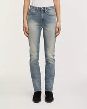 Light blue jeans worn by a person on a white background