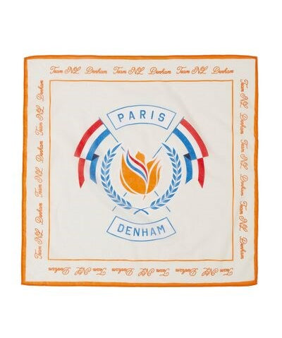 A white bandana with orange and blue details, featuring the text 'DENHAM' and a floral wreath design, along with the words 'PARIS' and 'ESSENTIAL'.